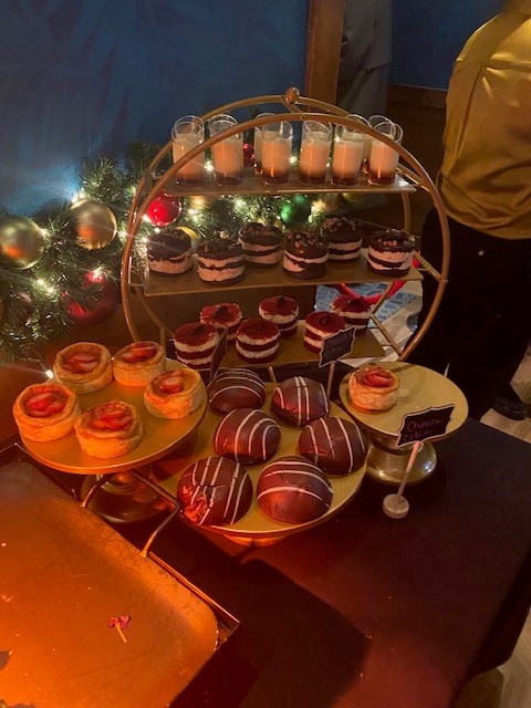 Assortment of delicious desserts on various trays